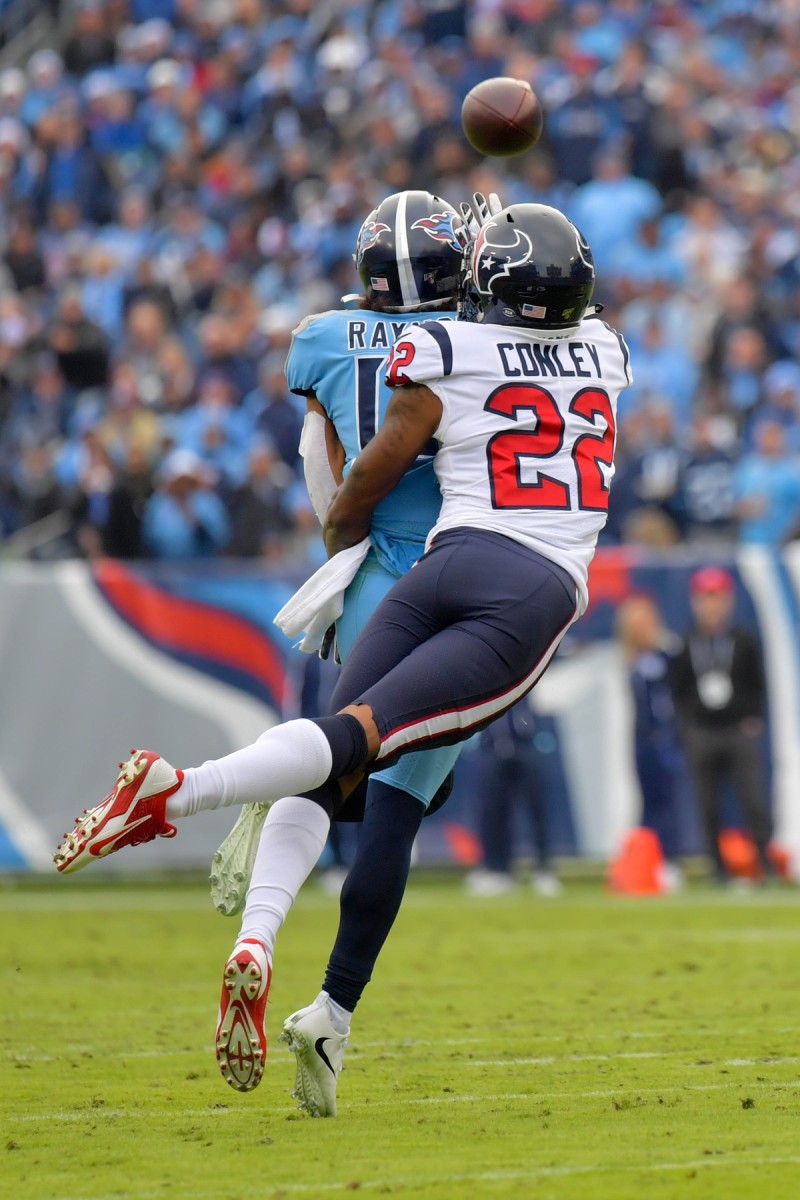 Dec 15, 2019; Texans cornerback Gareon Conley (22) blocks a pass intended for Titans receiver Kalif Raymond (14). Mandatory Credit: Jim Brown-USA TODAY Sports
